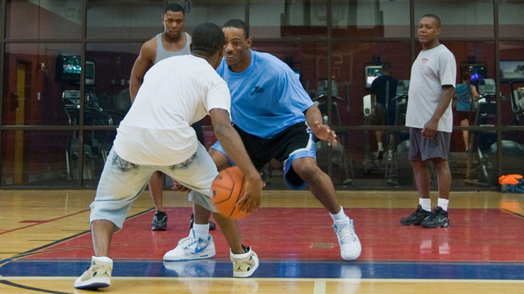 Young men playing basketball