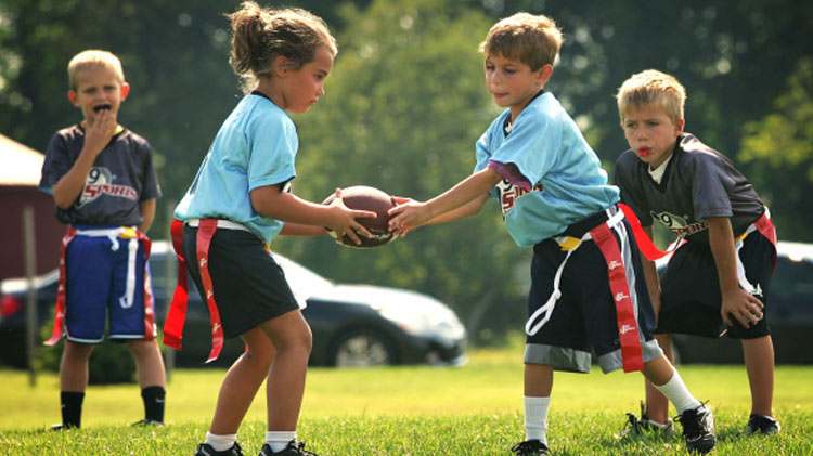 little kids playing flag football